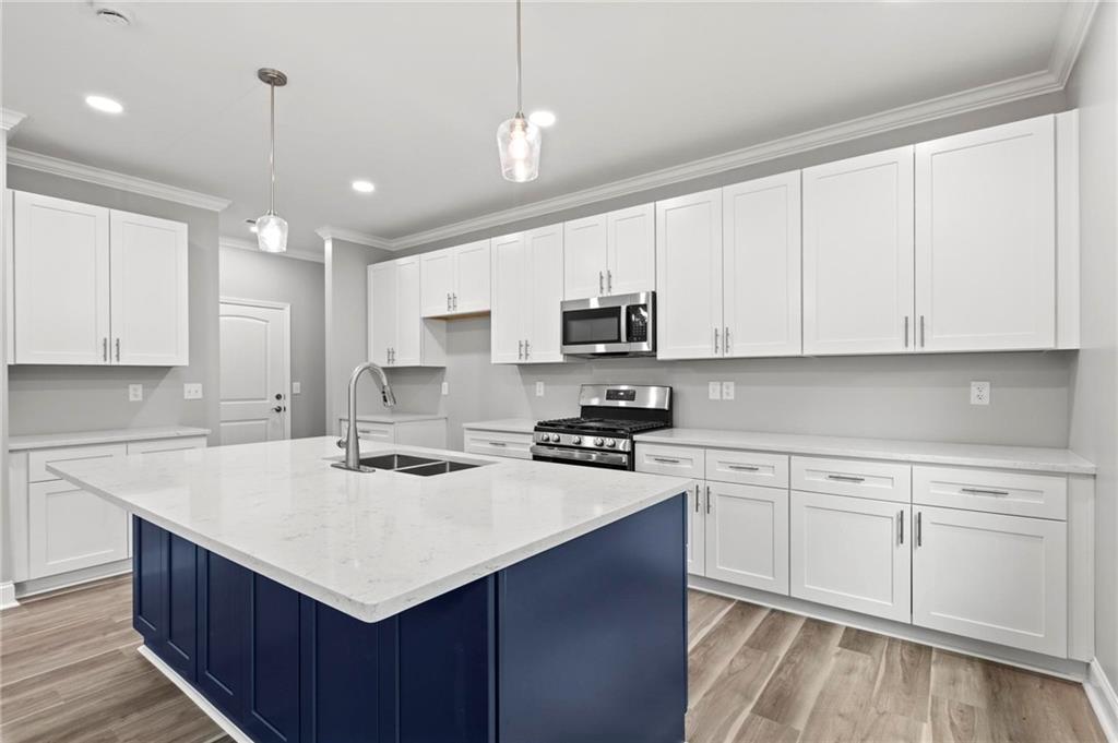 5341 Stewart Mill Road Douglasville, GA 30135 - Photo 1 of 36 a kitchen with kitchen island white cabinets appliances and cabinets