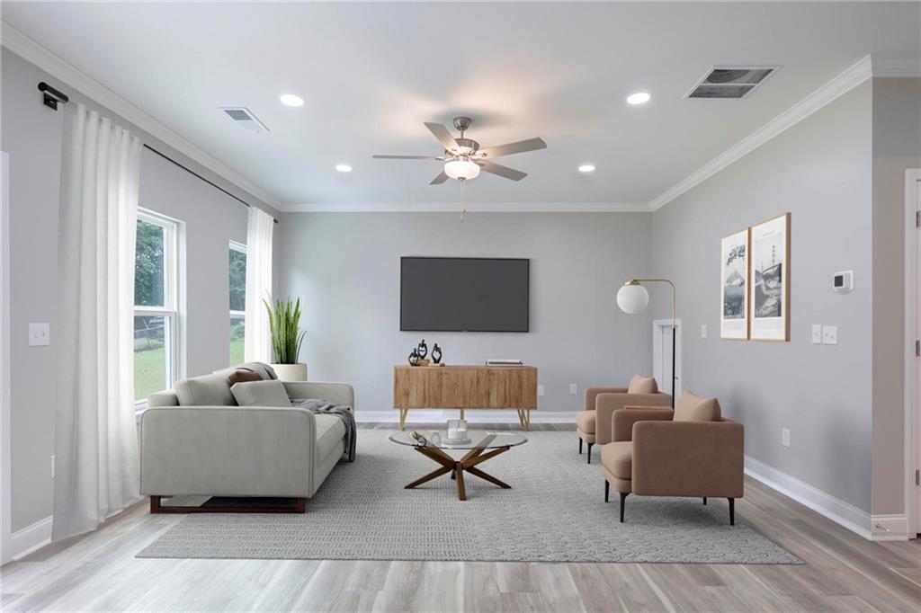 5341 Stewart Mill Road Douglasville, GA 30135 - Photo 16 of 36 a living room with furniture and a lamp