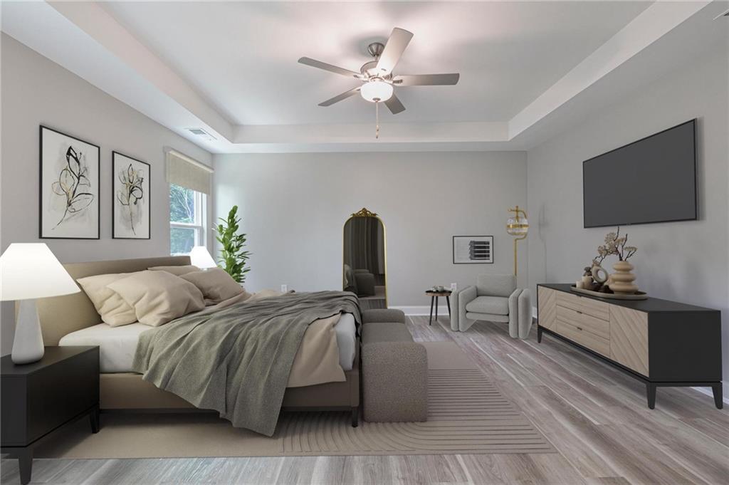 5341 Stewart Mill Road Douglasville, GA 30135 - Photo 24 of 36 a bedroom with a bed and a flat screen tv