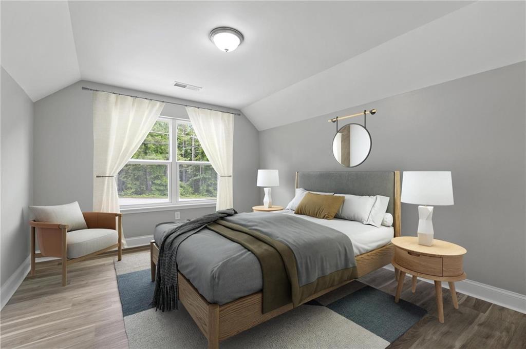 5341 Stewart Mill Road Douglasville, GA 30135 - Photo 32 of 36 a bedroom with bed and a window