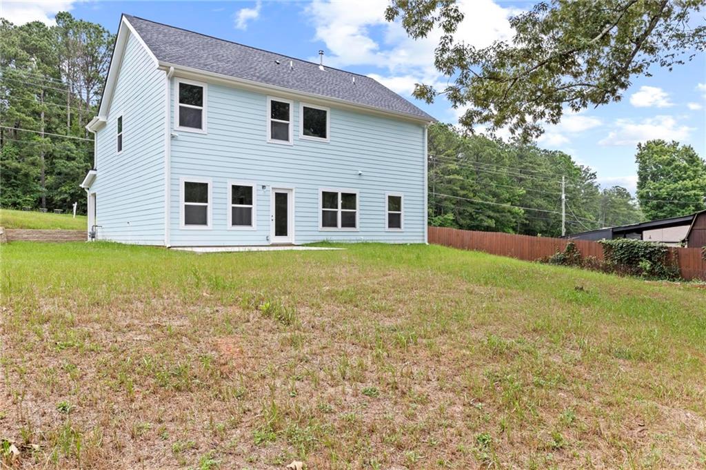5341 Stewart Mill Road Douglasville, GA 30135 - Photo 33 of 36 a view of a house with a yard and sitting area