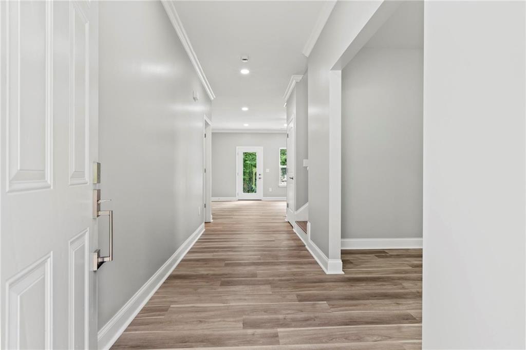 5341 Stewart Mill Road Douglasville, GA 30135 - Photo 4 of 36 a view of a hallway with wooden floor