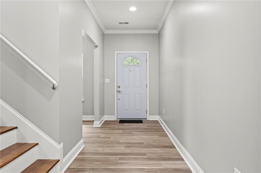 5341 Stewart Mill Road Douglasville, GA 30135 - Photo 5 of 36 a view of a hallway with wooden floor