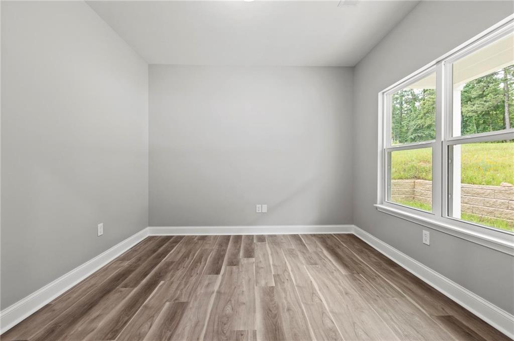 5341 Stewart Mill Road Douglasville, GA 30135 - Photo 6 of 36 a view of a room with wooden floor and window