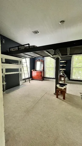 a view of room with gym equipment