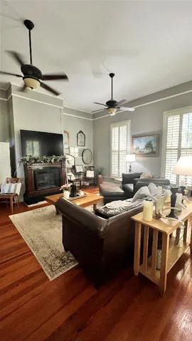 a kitchen with stainless steel appliances granite countertop a stove and a wooden floors