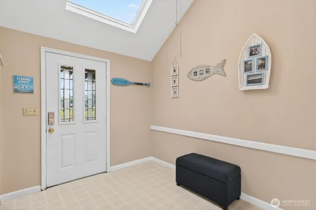 a view of room with window and hallway