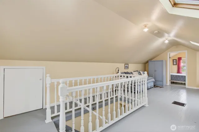 a bedroom with furniture and a window