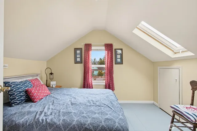 a bedroom with a bed and dresser