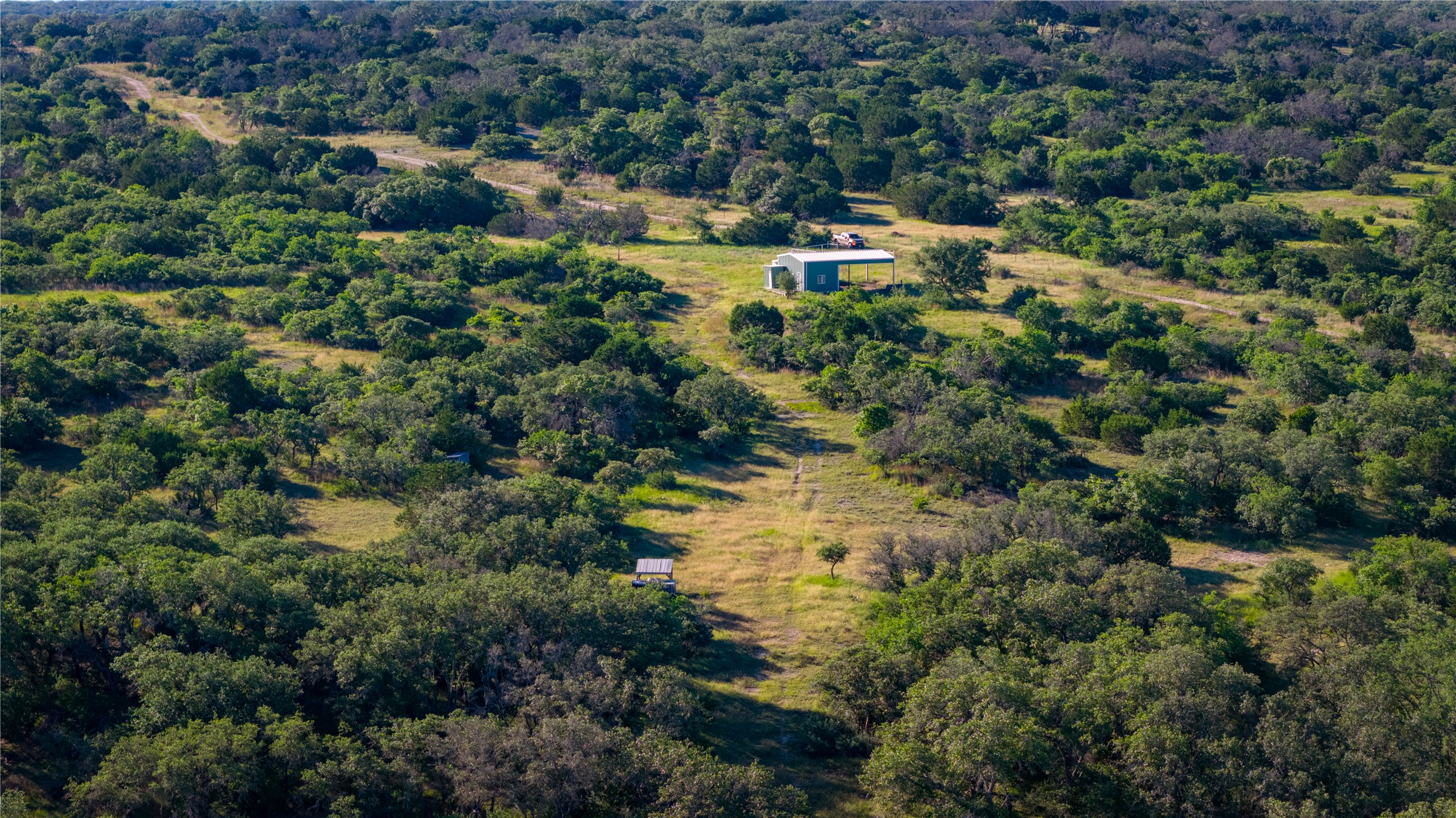 3276 Link Road Doss, TX 78618 - Photo 32 of 35 a view of a lake with a house