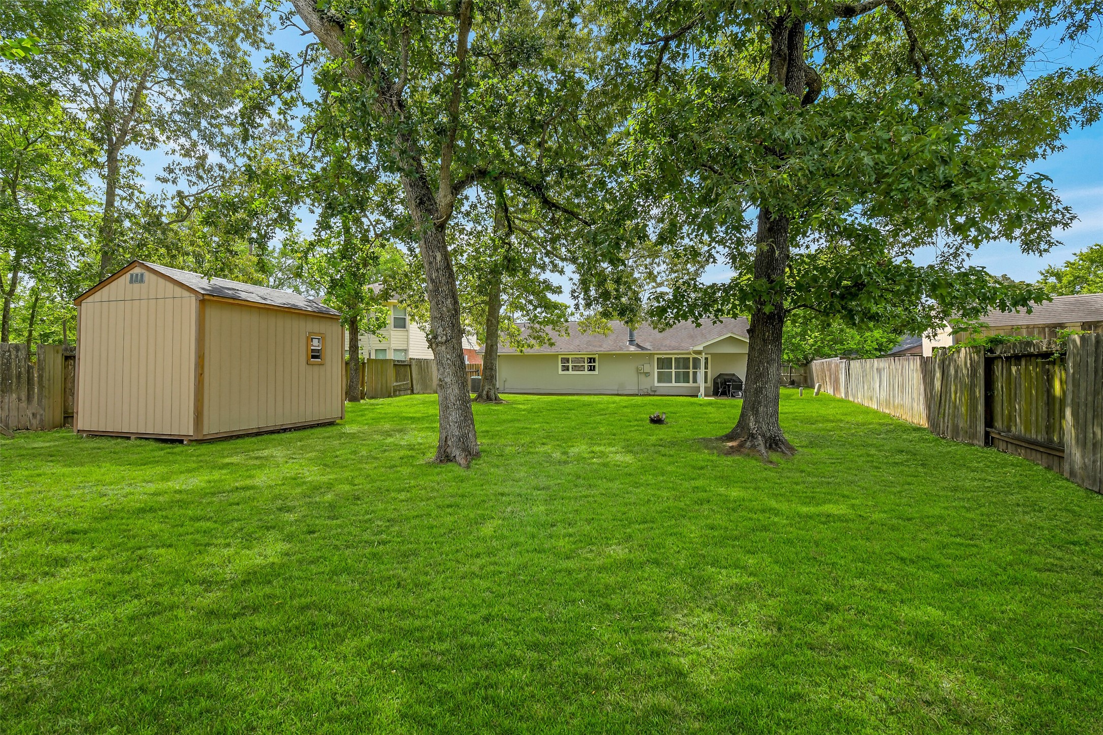 710 Razee Court Crosby, TX 77532 - Photo 25 of 31 a view of a backyard with large trees