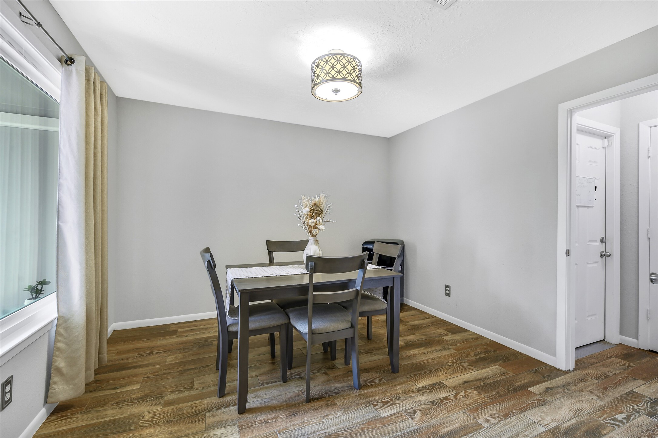 710 Razee Court Crosby, TX 77532 - Photo 5 of 31 a view of a dining room with furniture and wooden floor