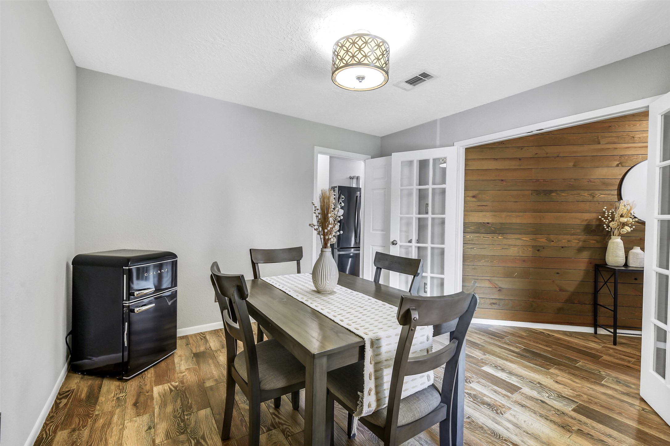 710 Razee Court Crosby, TX 77532 - Photo 6 of 31 a view of a dining room with furniture and wooden floor