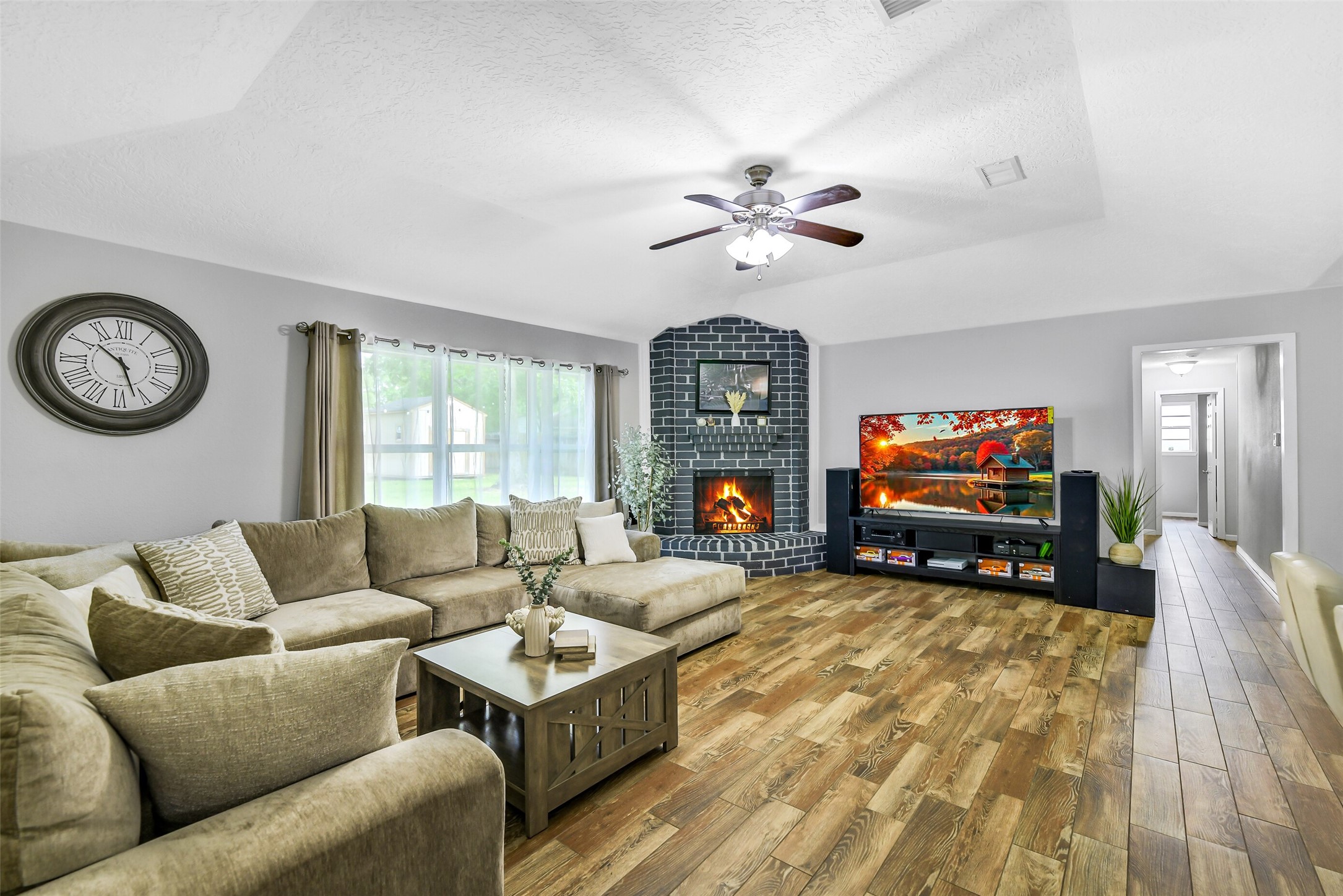710 Razee Court Crosby, TX 77532 - Photo 7 of 31 a living room with furniture a fireplace and a flat screen tv