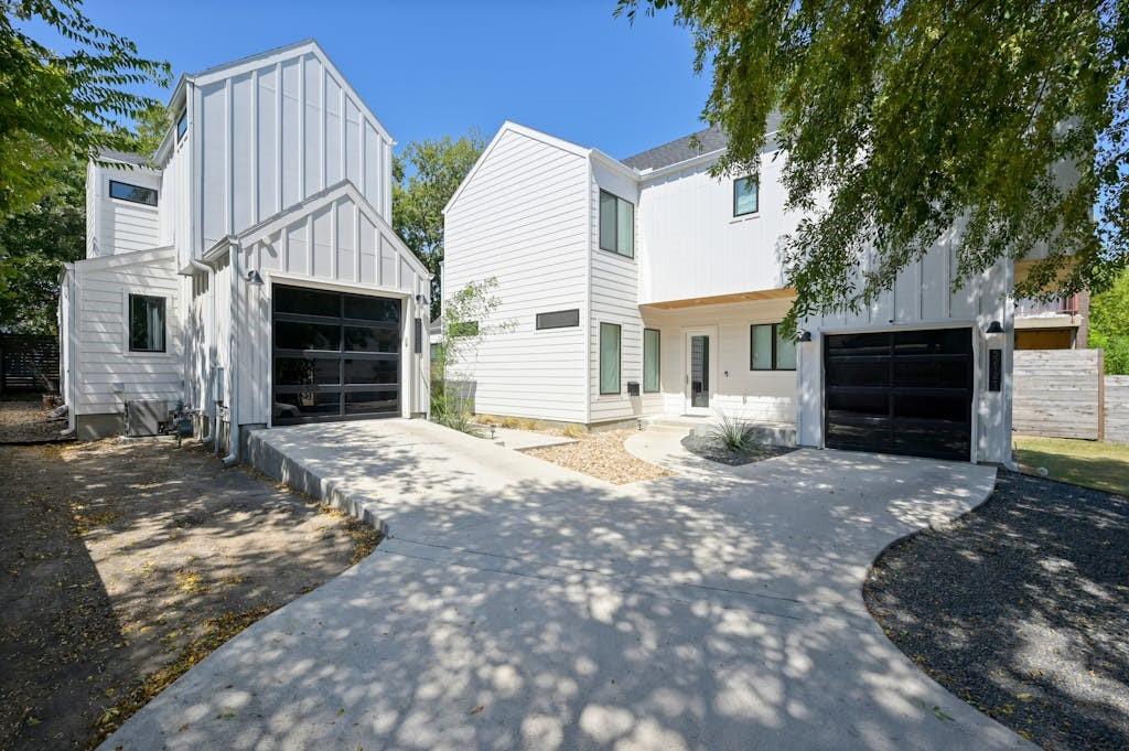 5212 Huisache Street, Unit 2 Austin, TX 78751 - Photo 1 of 30 View of front of property featuring board and batten siding, driveway, and an outdoor structure