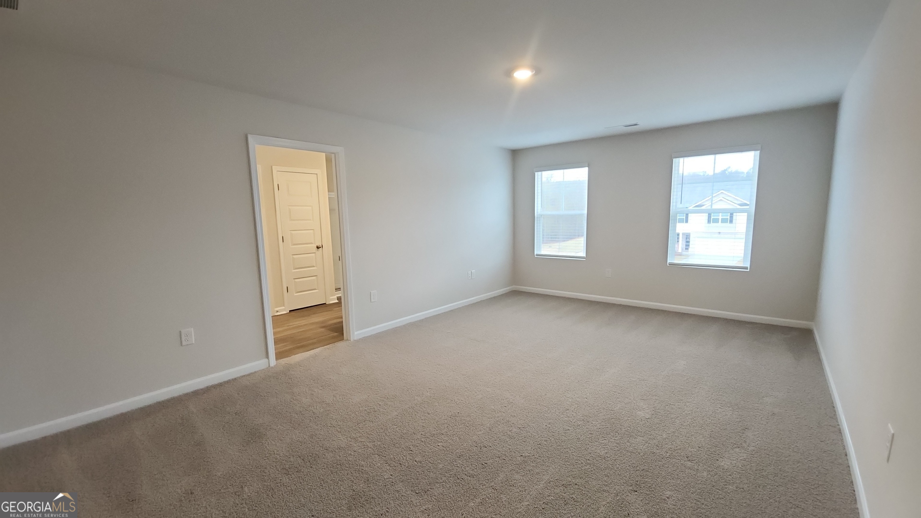 501 Vervain Drive, Unit 174 Locust Grove, GA 30248 - Photo 16 of 33 an empty room with windows