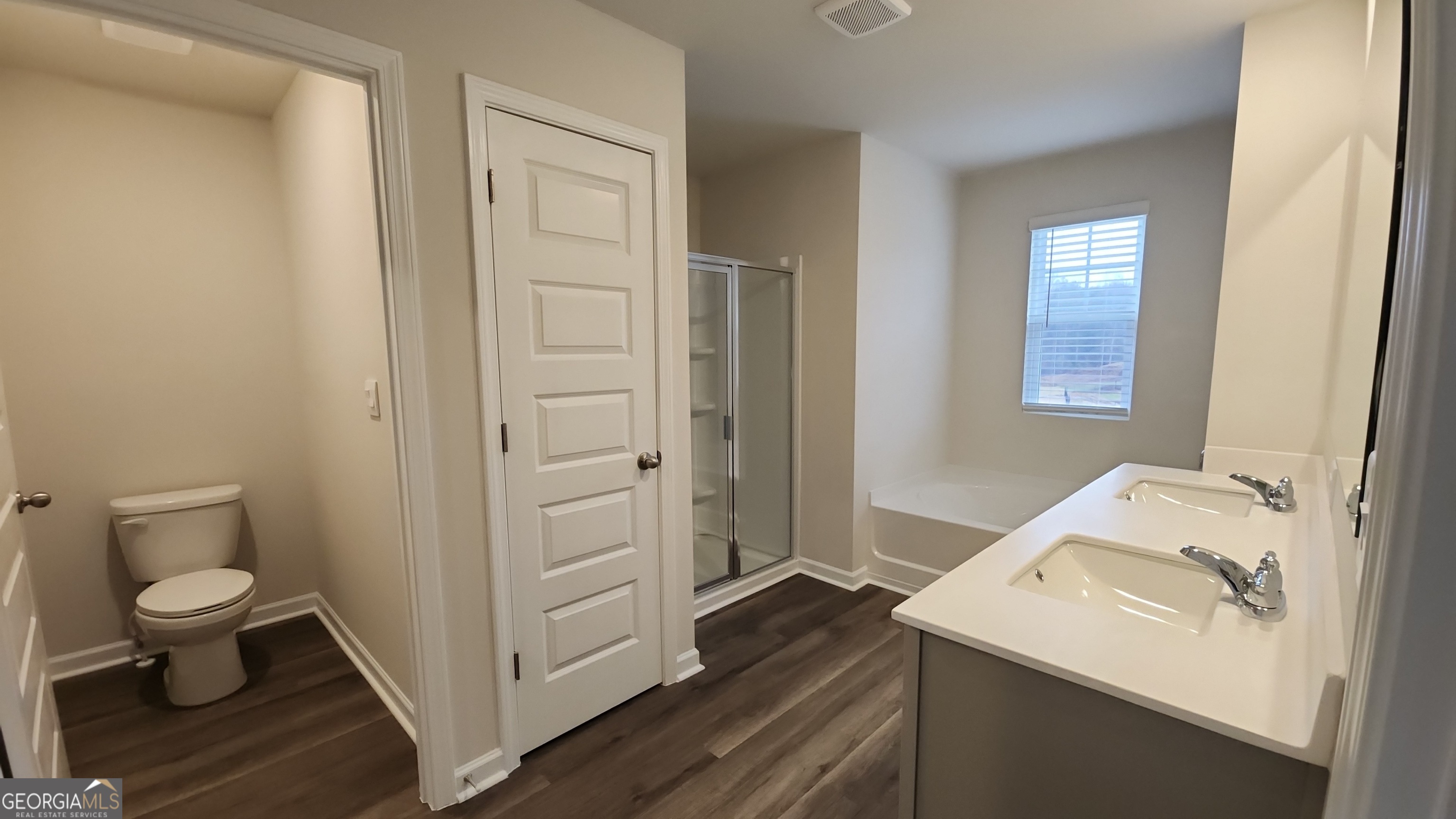 501 Vervain Drive, Unit 174 Locust Grove, GA 30248 - Photo 18 of 33 a bathroom with a sink toilet and vanity
