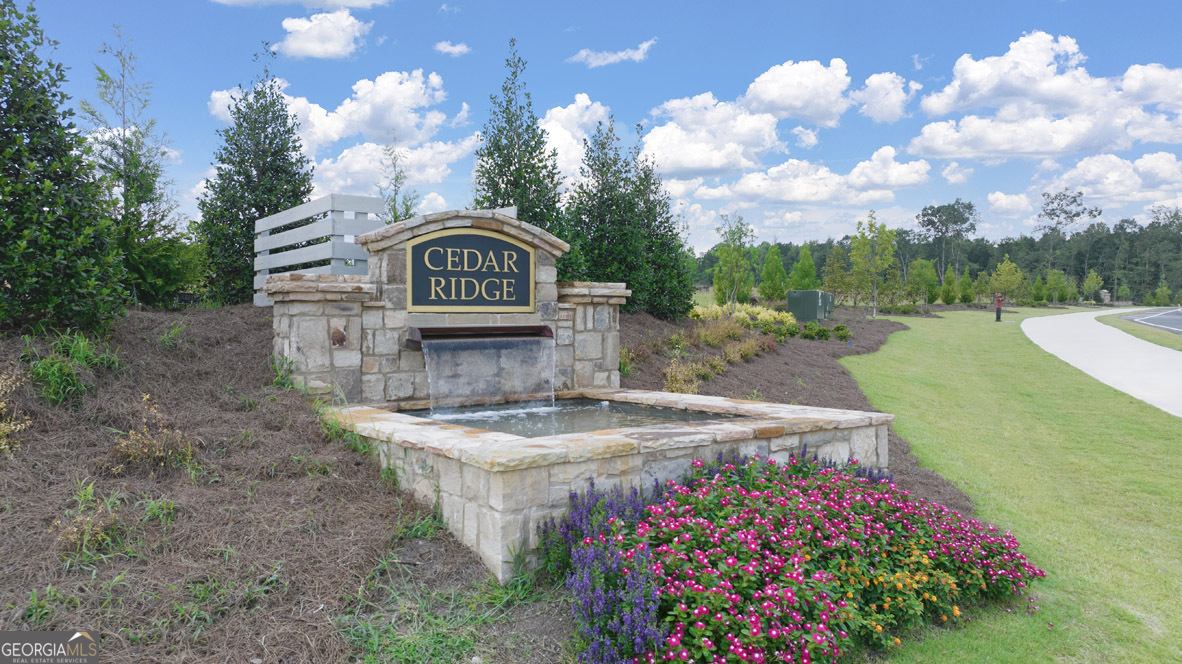 501 Vervain Drive, Unit 174 Locust Grove, GA 30248 - Photo 2 of 33 a front view of a house with garden