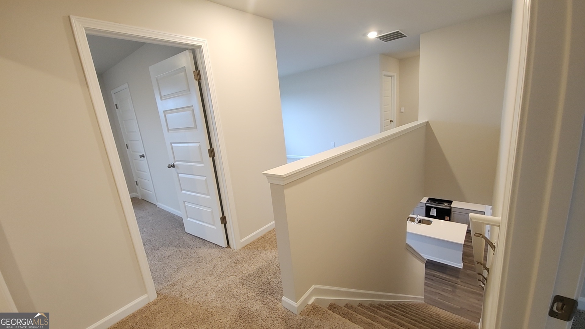 501 Vervain Drive, Unit 174 Locust Grove, GA 30248 - Photo 21 of 33 a view of hallway with stairs
