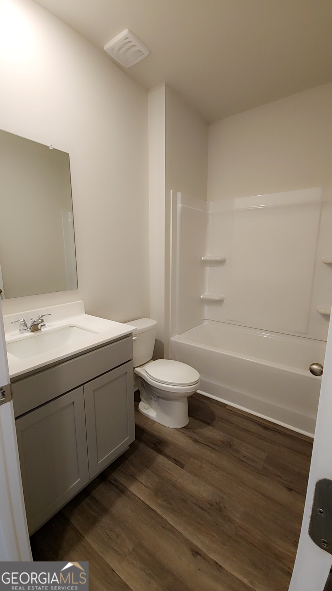 501 Vervain Drive, Unit 174 Locust Grove, GA 30248 - Photo 30 of 33 a bathroom with a sink a toilet and shower