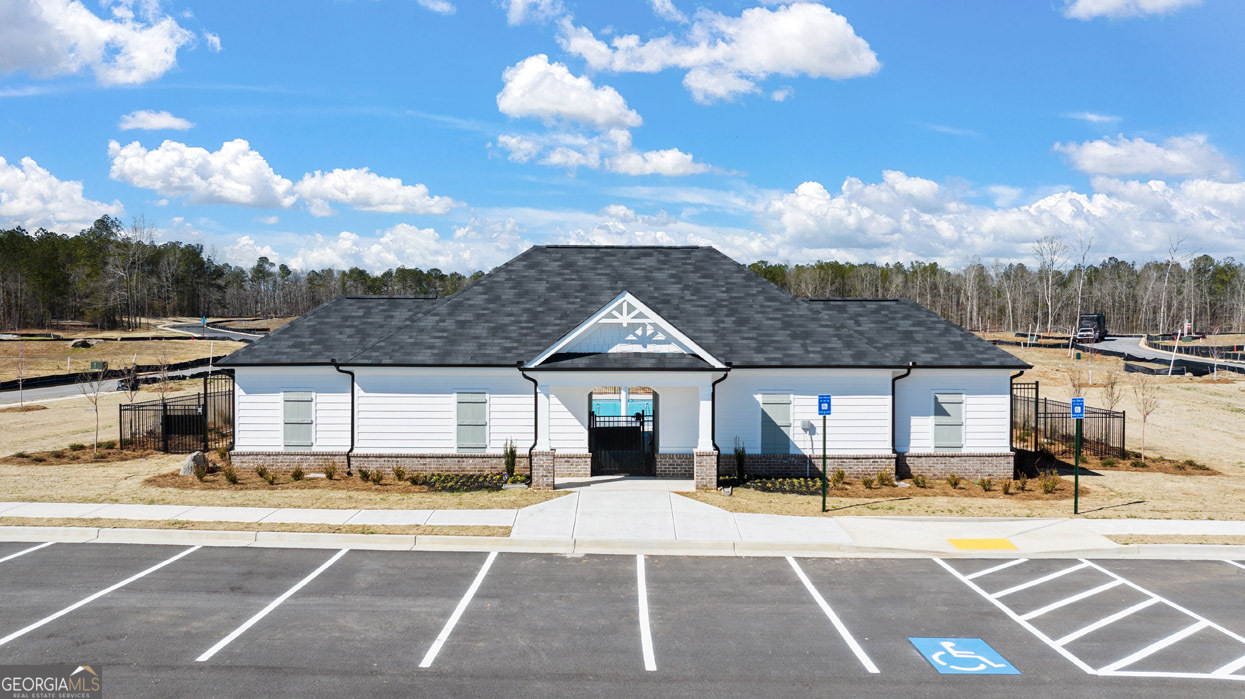 501 Vervain Drive, Unit 174 Locust Grove, GA 30248 - Photo 32 of 33 a front view of a building with a garden