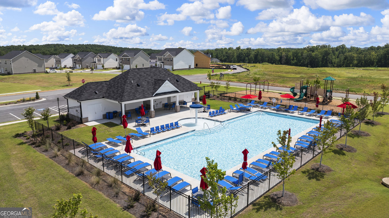 501 Vervain Drive, Unit 174 Locust Grove, GA 30248 - Photo 4 of 33 an aerial view of a yard and swimming pool