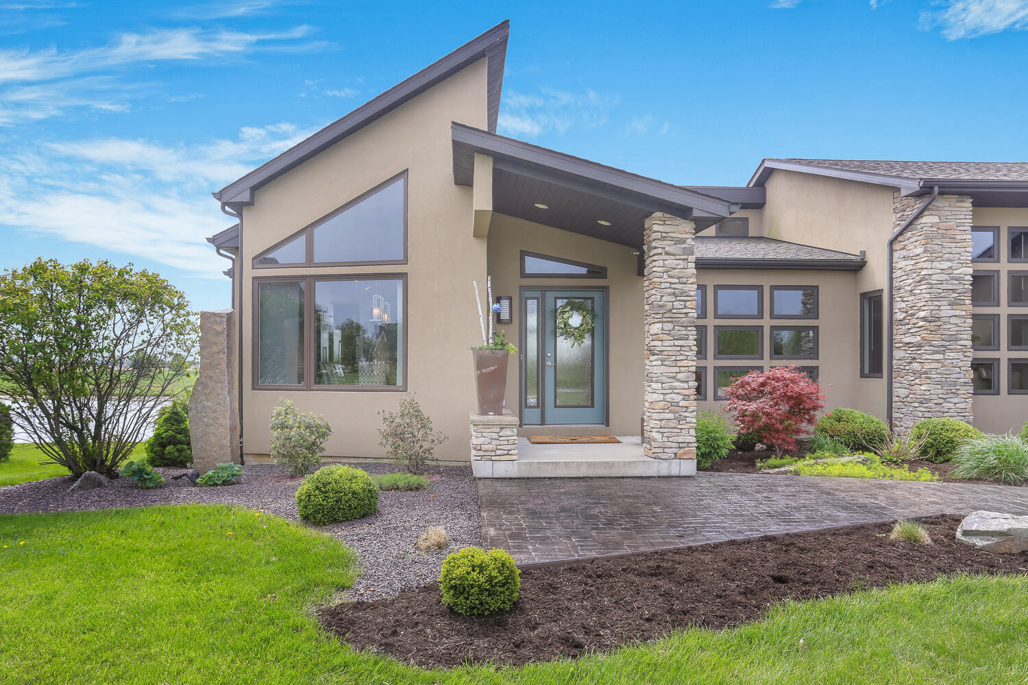 1411 Cross Creek Road Mahomet, IL 61853 - Photo 12 of 70 a front view of a house with garden