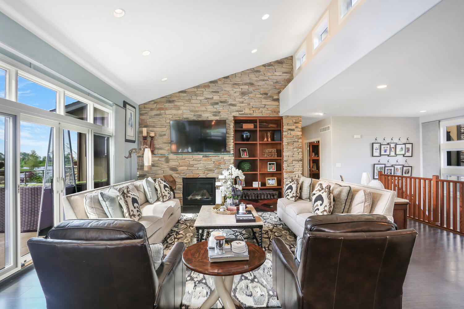 1411 Cross Creek Road Mahomet, IL 61853 - Photo 26 of 70 a living room with furniture fireplace and a flat screen tv