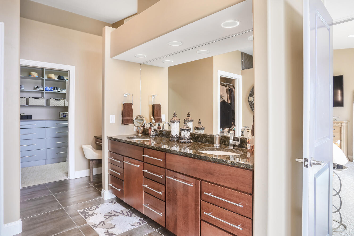 1411 Cross Creek Road Mahomet, IL 61853 - Photo 36 of 70 a bathroom with a double vanity sink and a mirror