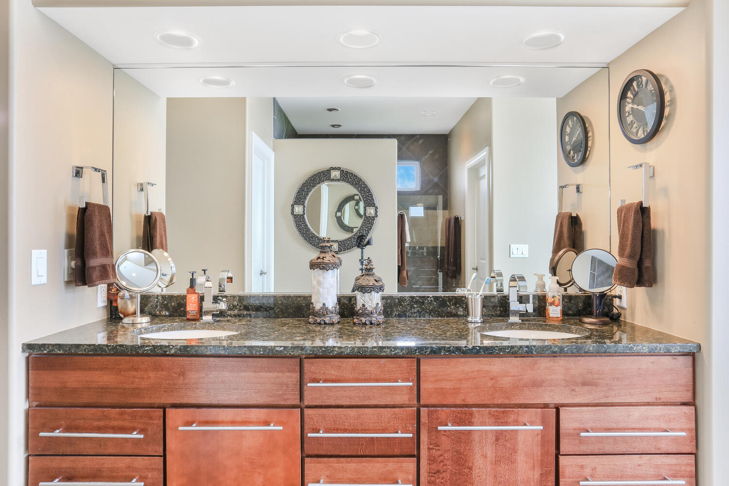 1411 Cross Creek Road Mahomet, IL 61853 - Photo 39 of 70 a bathroom with a granite countertop sink and a large mirror