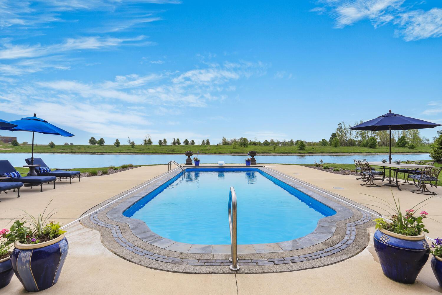 1411 Cross Creek Road Mahomet, IL 61853 - Photo 5 of 70 a view of a swimming pool with a lounge chairs