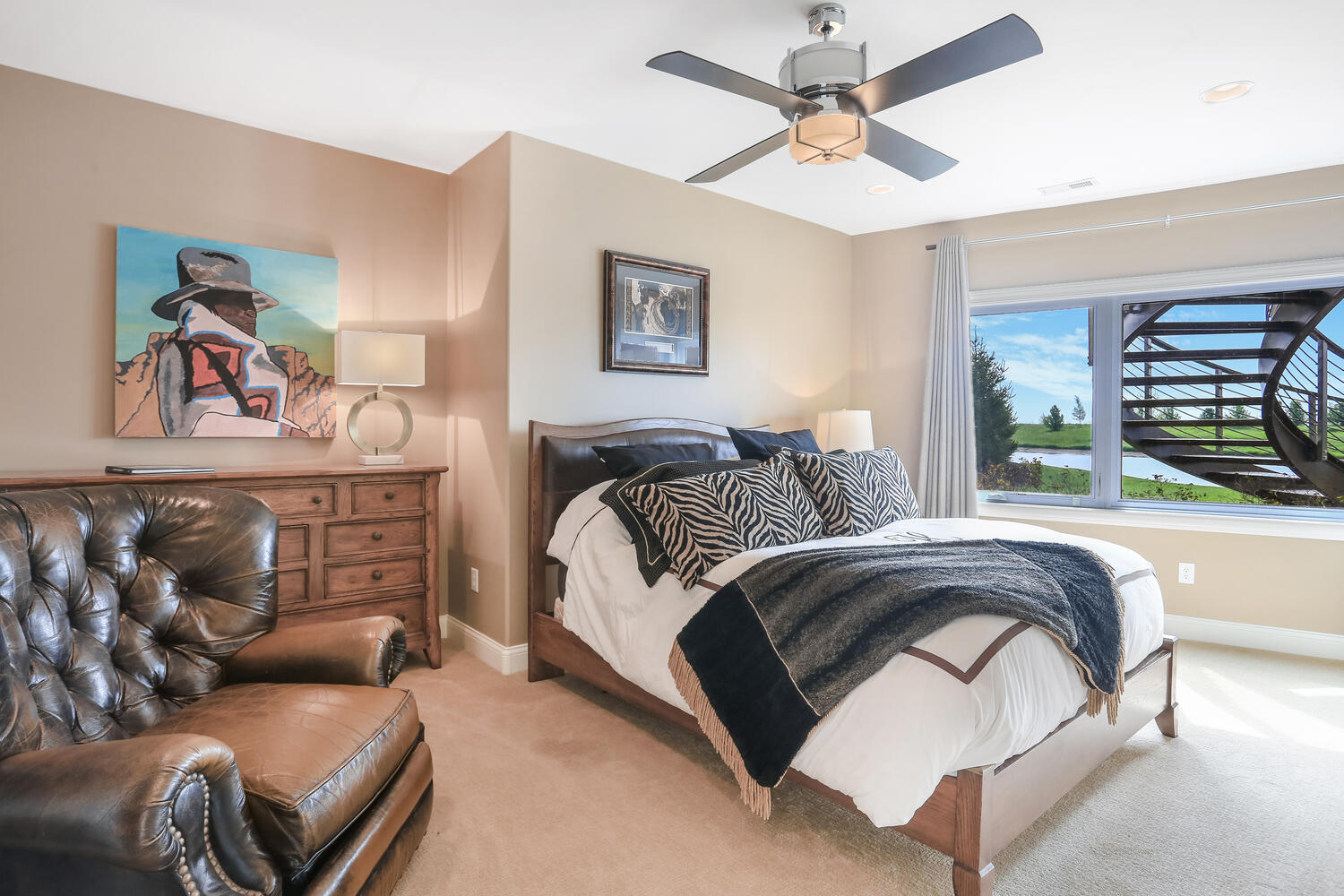 1411 Cross Creek Road Mahomet, IL 61853 - Photo 55 of 70 a spacious bedroom with a bed a couch and a window