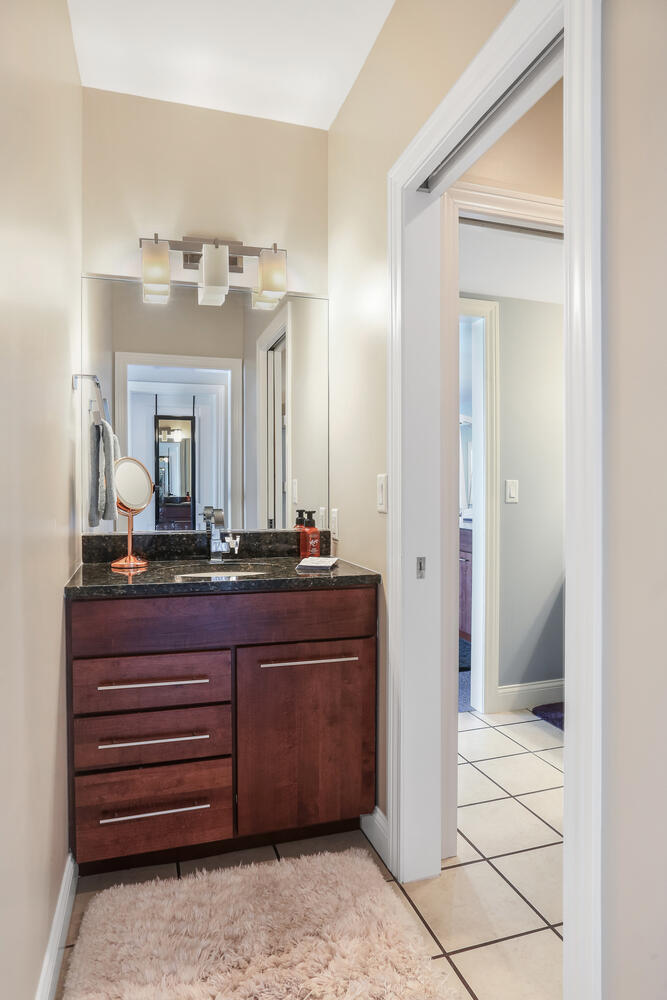 1411 Cross Creek Road Mahomet, IL 61853 - Photo 60 of 70 a bathroom with a sink and a mirror