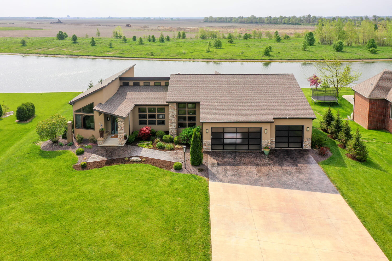 1411 Cross Creek Road Mahomet, IL 61853 - Photo 65 of 70 an aerial view of a house with garden space and lake view