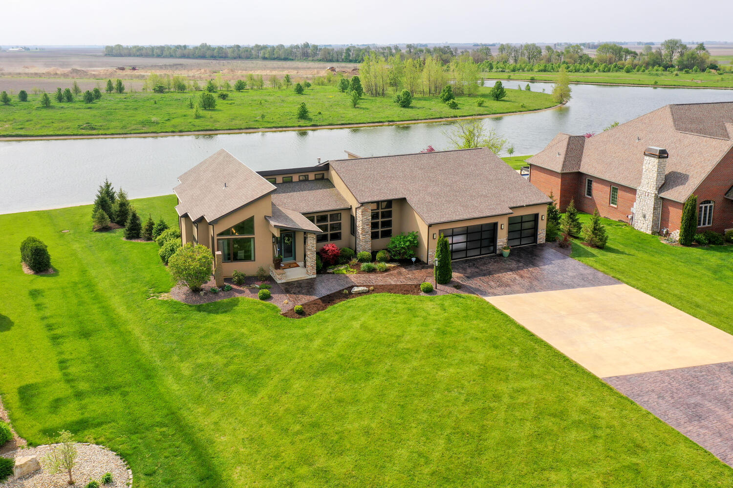1411 Cross Creek Road Mahomet, IL 61853 - Photo 66 of 70 an aerial view of a house with pool lake view and mountain view