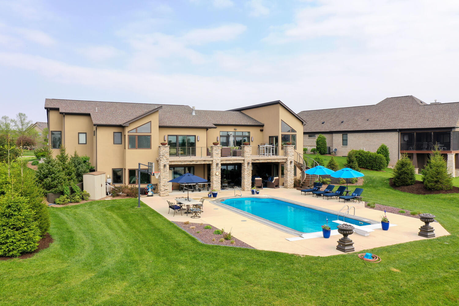 1411 Cross Creek Road Mahomet, IL 61853 - Photo 67 of 70 a view of a house with a yard patio and swimming pool