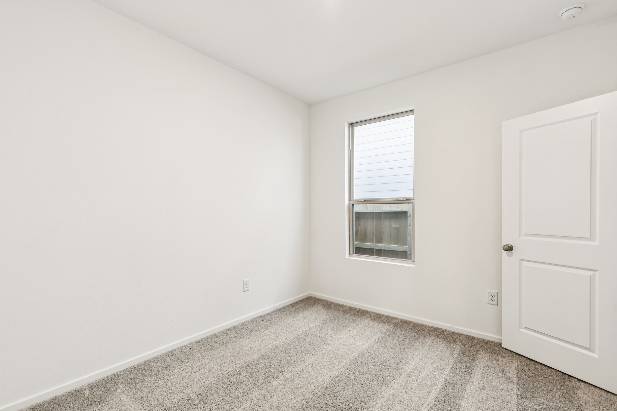 14985 Rustic Moon Road Conroe, TX 77302 - Photo 19 of 32 an empty room with a window
