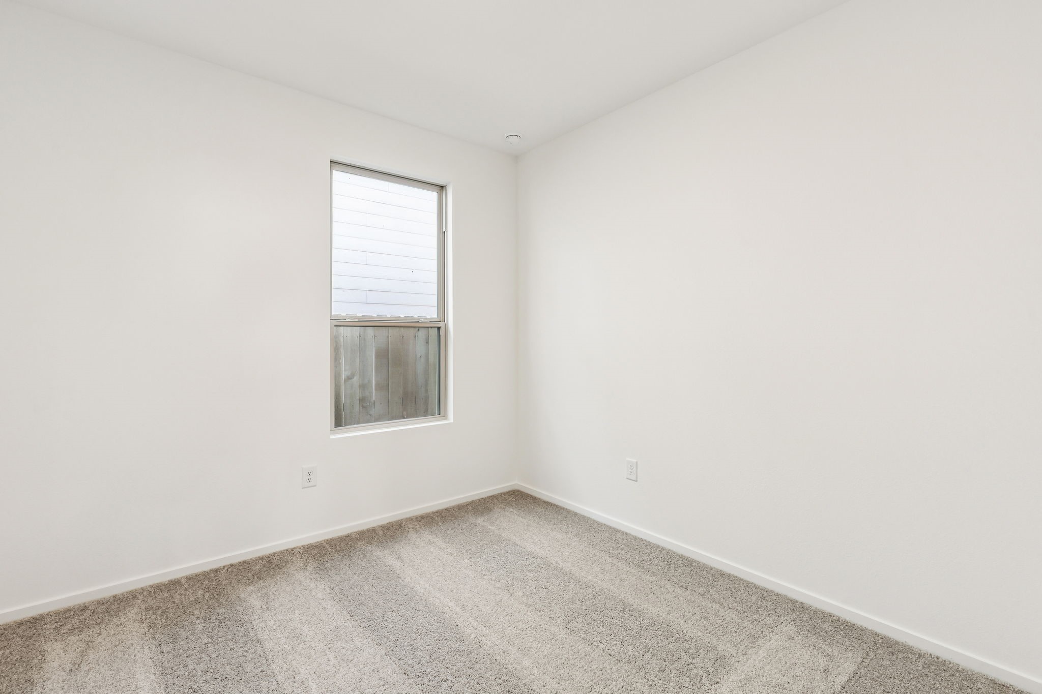 14985 Rustic Moon Road Conroe, TX 77302 - Photo 22 of 32 a view of an empty room with a window