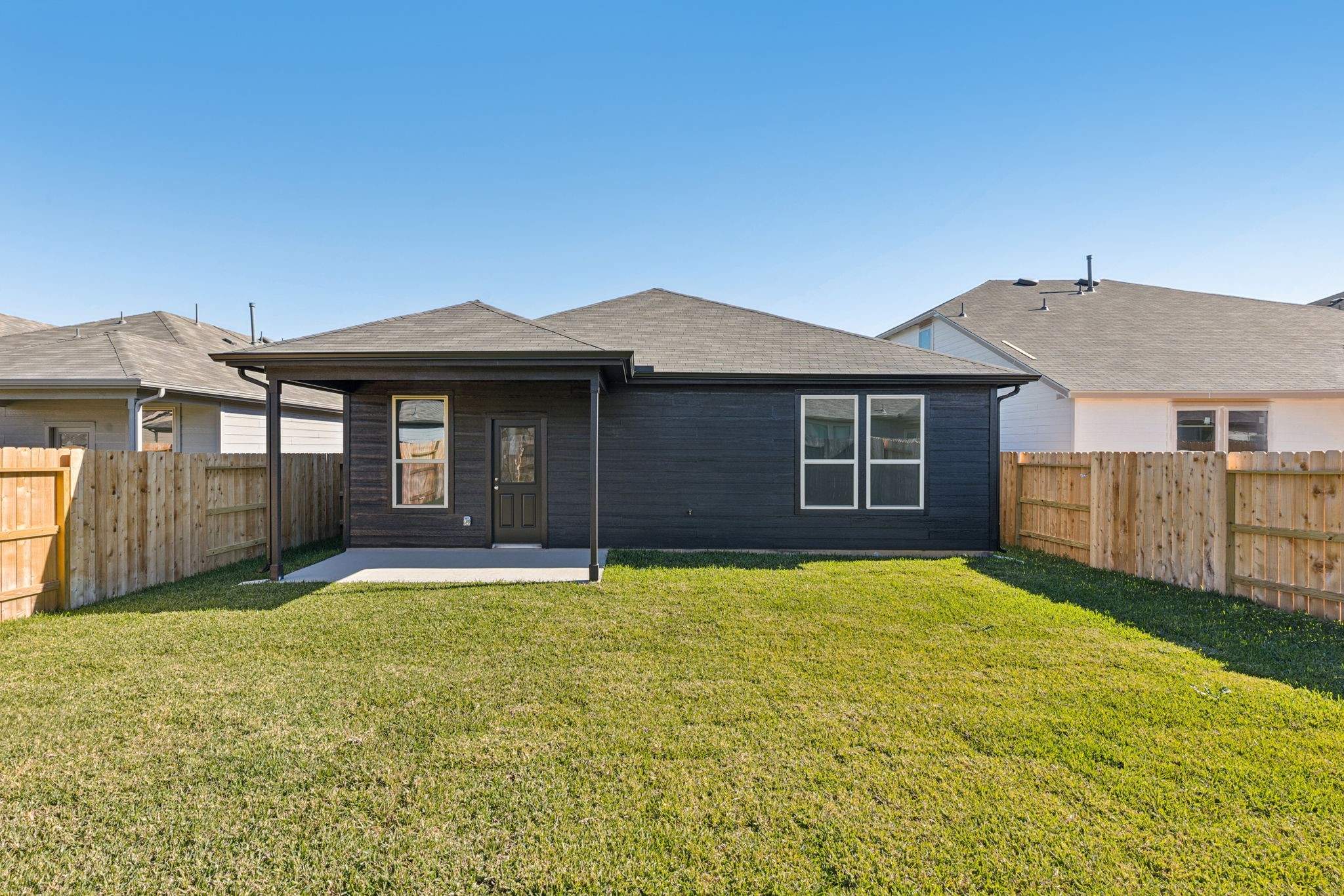 14985 Rustic Moon Road Conroe, TX 77302 - Photo 25 of 32 a front view of a house with a yard