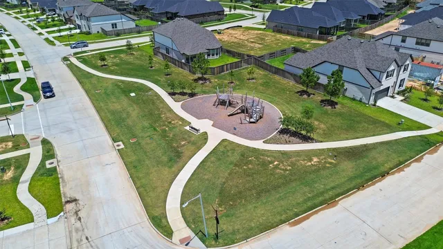 an aerial view of a house with a swimming pool
