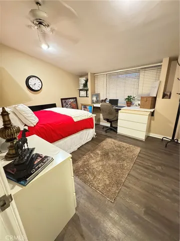 a backyard of a house with barbeque oven a table and chairs