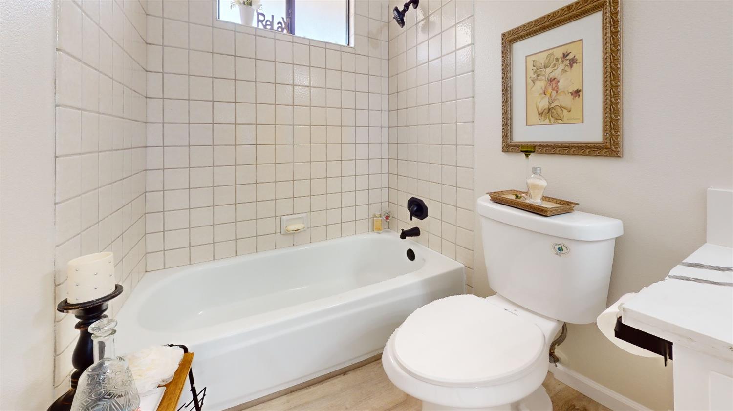 2395 Keats Avenue Clovis, CA 93611 - Photo 14 of 22 a white toilet sitting next to a bath tub