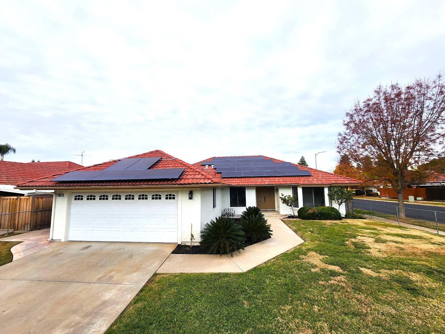 2395 Keats Avenue Clovis, CA 93611 - Photo 2 of 22 a front view of a house with a yard