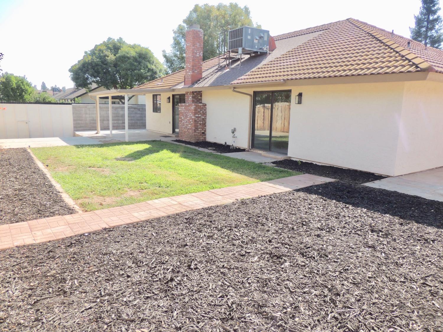 2395 Keats Avenue Clovis, CA 93611 - Photo 21 of 22 a view of a house with a yard and sitting area