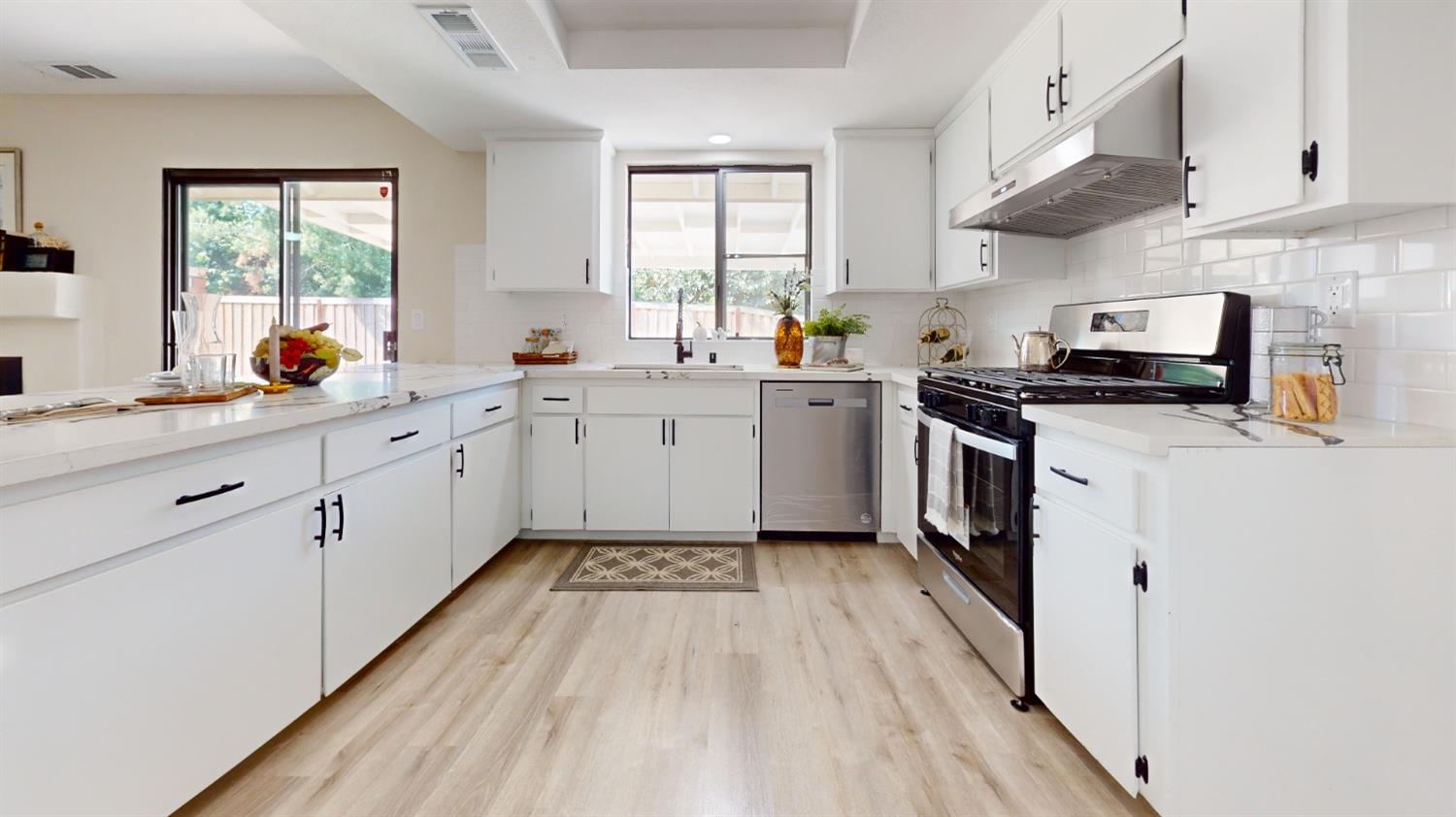 2395 Keats Avenue Clovis, CA 93611 - Photo 4 of 22 a kitchen with a sink a stove and cabinets
