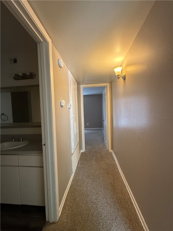 603 East 29th Street, Unit 4 Bryan, TX 77803 - Photo 6 of 8 a view of a hallway with closet
