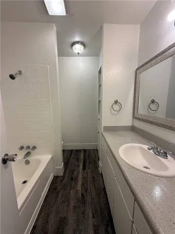 an empty room with closet and chandelier fan