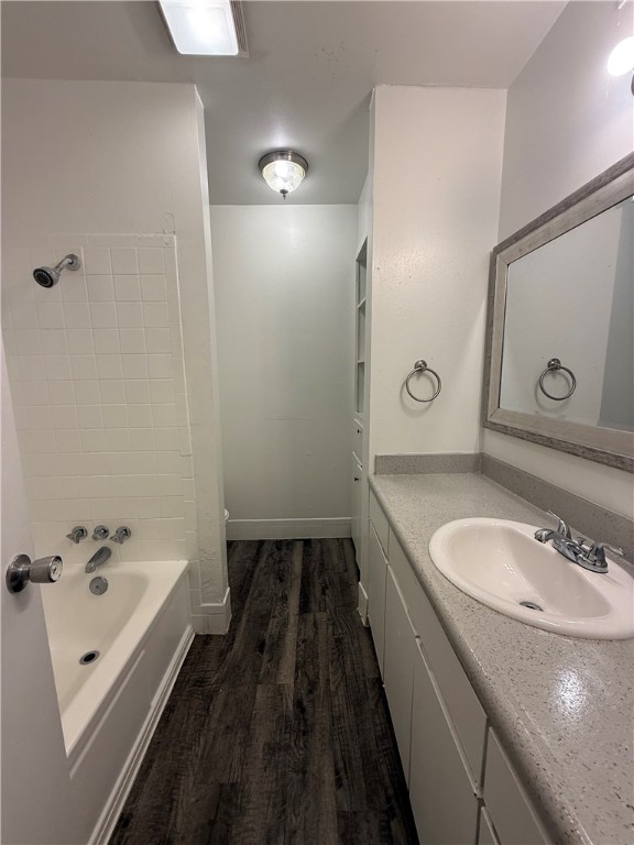 603 East 29th Street, Unit 4 Bryan, TX 77803 - Photo 7 of 8 a bathroom with a granite countertop sink tub and mirror