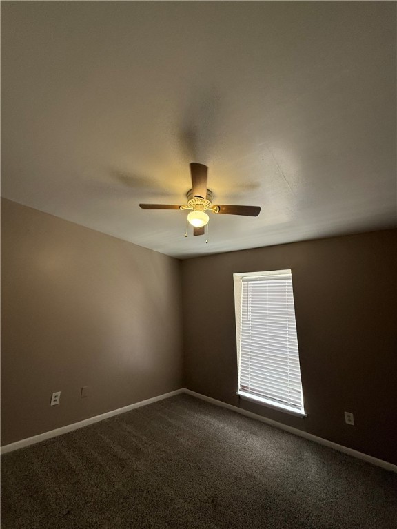 603 East 29th Street, Unit 4 Bryan, TX 77803 - Photo 8 of 8 an empty room with closet and chandelier fan