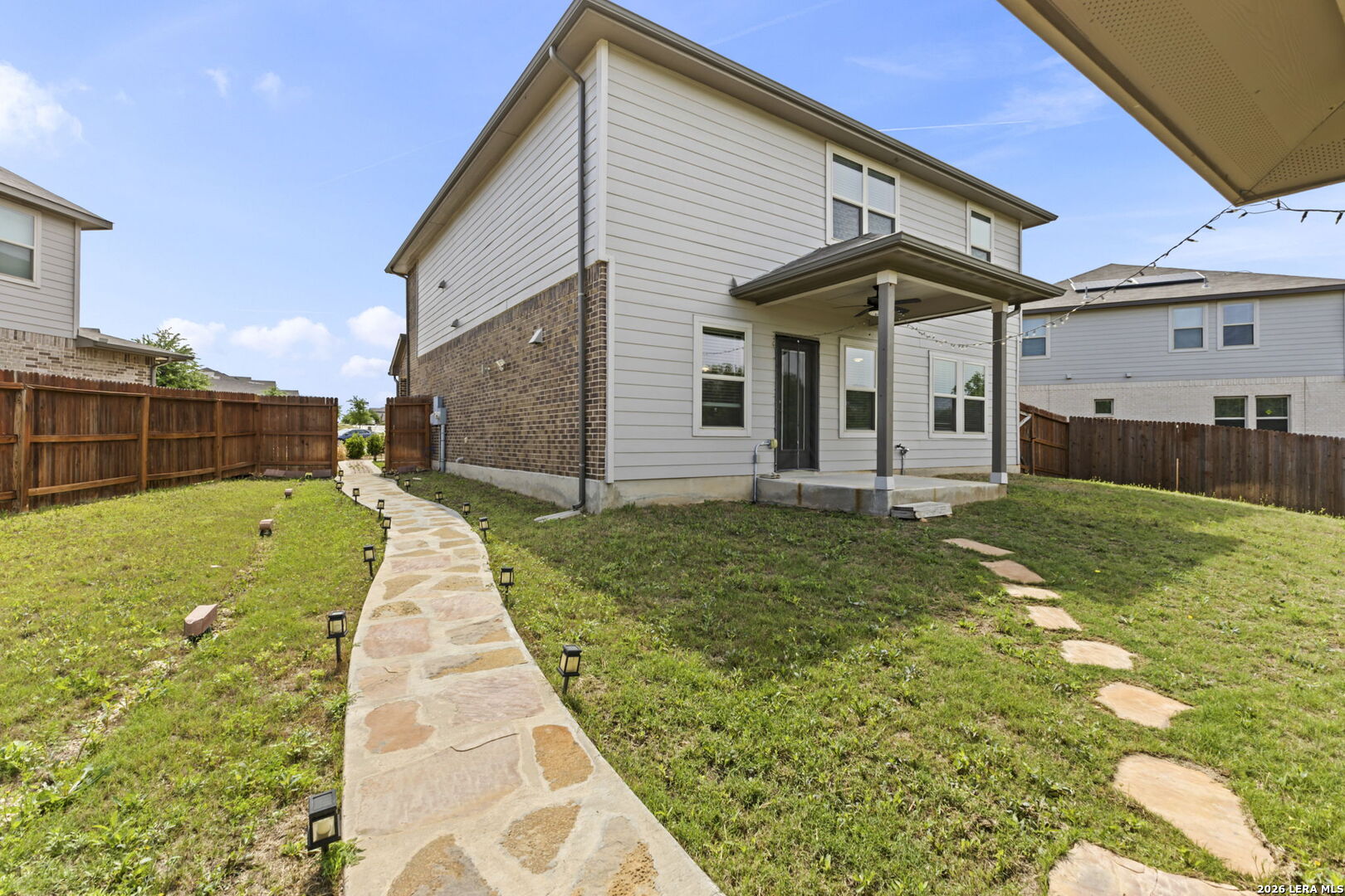 12221 Icon Ridge San Antonio, TX 78253 - Photo 42 of 46 a front view of a house with a yard
